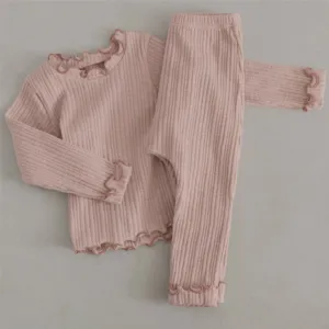 Infant ribbed long sleeve top and pants detail view with cute lettuce edge trim.
