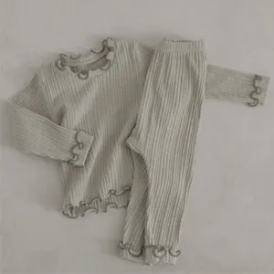 Lettuce edge ribbed long sleeve top and trousers detail view for infant baby girls