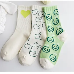 Set di calzini medi in cotone con stampa di dinosauro e smiley, stile carino e casual alla moda.
