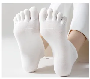 Close-up detail of white cotton five-toe socks, breathable mesh summer short split-toe socks.