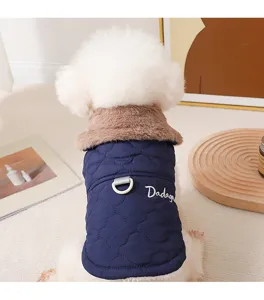 Close-up detail of the puppy winter coat with cozy fur collar, leash ring and cute text.