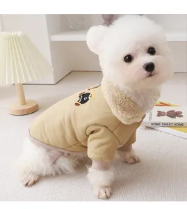 Close-up detail of khaki pet winter cotton coat with fluffy fleece collar and cute bear patch.