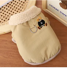 Close-up detail of warm winter dog coat with cozy fleece collar and cute bear embroidery design.
