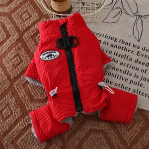 Detailed view of the red winter dog fleece jacket with traction ring and warm cotton padding.