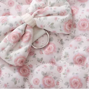 Cute floral pet vest detail, pink quilted fabric with sweet bow and metal D-ring.