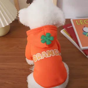 Detailed winter pet hoodie in orange with flower patch and letter print for cozy style.