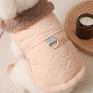 Close-up detail of warm winter dog coat with cozy fur collar and D-ring leash attachment.