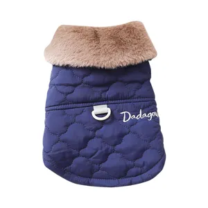 Warm winter dog coat with plush collar, quilted blue fabric and traction ring for small pets.