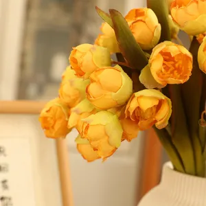 Artificial yellow silk flower bouquet for home decoration, beautiful faux floral arrangement.