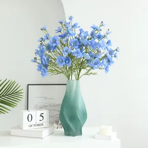 Artificial blue flower bouquet in green frosted glass vase home decor table centerpiece