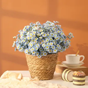Artificial blue daisy flower bouquet in woven basket for home decor and photography.