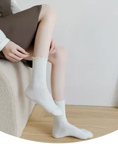 White ruffled cotton crew socks detail, perfect for everyday wear and college styles.