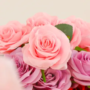 Beautiful artificial rose bouquet in soft pink and purple, perfect for wedding decor.