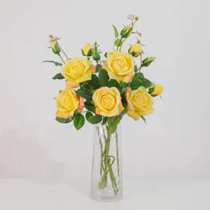 Artificial yellow rose flower bouquet with clear glass vase for home and wedding decor table