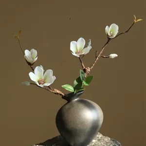 Artificial magnolia branch detail, elegant faux flower arrangement for home decor and display