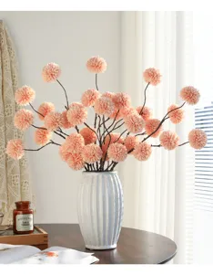 Artificial ping pong chrysanthemum flower arrangement in white ceramic vase for home decor.