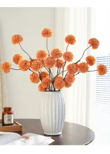 Artificial ping pong chrysanthemum flower bouquet with white ceramic vase for home decor setup.
