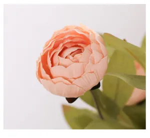 Close up of artificial peach ranunculus silk flower, vintage floral detail for home decor