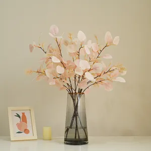 Artificial eucalyptus branches fake money leaves plant for home decor floral arrangement vase table.