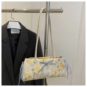 Chic Chinese style floral embroidered shoulder bag with cute blue bow and heart design.