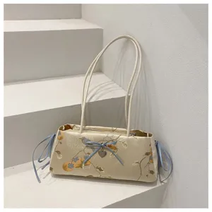 Chinese style silk shoulder bag with elegant bow detail and delicate embroidery pattern