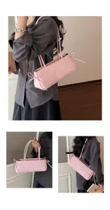 Pink star pattern underarm shoulder bag with side bow design for women daily commute style.