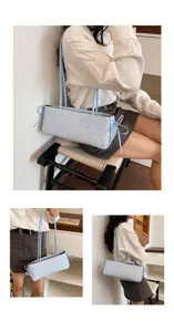 Stylish light blue shoulder bag with star pattern and side bow details for women commute chic.