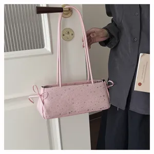 Pink star print shoulder bag detail showing stylish daily design and cute side bows.