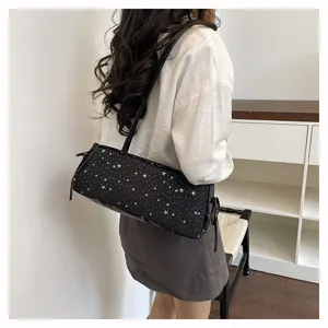 Black star pattern cylindrical shoulder bag detail view, stylish casual underarm bag