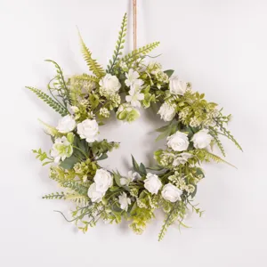 Artificial white rose flower wreath with green leaves for home wall decor and wedding hanging.