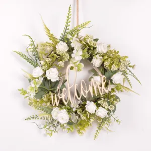 Detailed view of artificial rose flower wreath with wooden welcome sign for home wall decor.