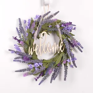 Detail view of purple artificial lavender floral wreath with wooden welcome sign for door decor.