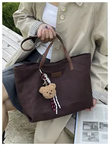 Large capacity brown corduroy tote bag for women, casual commuter handbag with cute plush bear.
