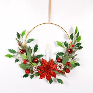 Christmas candle wreath wall hanging with pine needles berries and poinsettia flower decor.