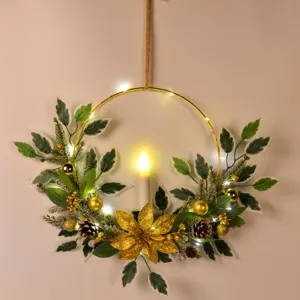 Christmas candle wreath detail, holiday wall hanging with LED lights and golden flowers.