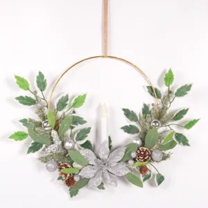 Christmas candle wreath wall hanging detail view showing pine needles, cones and silver flower.