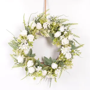 Artificial white rose flower wreath detail shot, perfect for door hanging and wall decor.