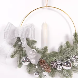 Christmas decorative candle wreath with pine needles and silver bow for holiday home decor.