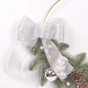 Christmas decorative wreath metal ring with silver bow and pine needles for home decor.
