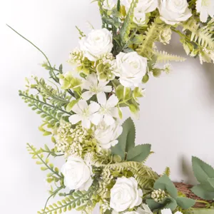 Artificial white rose flower wreath detail closeup for home decor wall hanging wedding welcome.