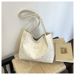 Borsa tote crema chic con stelle argentate e manici intrecciati per donna stile quotidiano