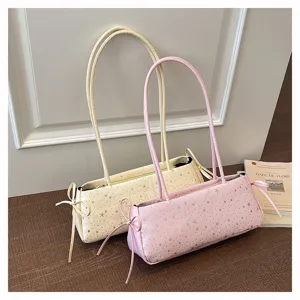 Chic minimalist underarm shoulder bag with trendy star patterns and sweet side bow details.