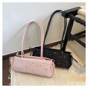 Detailed shot of trendy shoulder bags featuring silver star patterns and cute side bow designs.