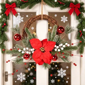 Christmas rattan wreath decoration with simulated poinsettia, pine branches and berries for door.