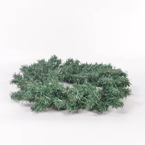 Artificial pine needle wreath candle holder for Christmas table holiday home decor detail.