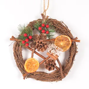 Christmas vine pentagram wreath with pine cones dried oranges and berries for door decor.
