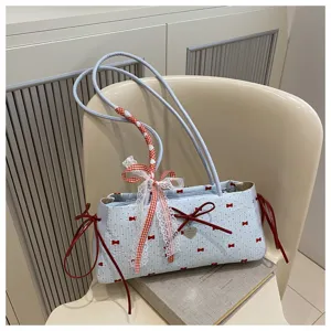 Cute bow shoulder underarm bag with lace ribbon and contrast red details for women fashion.