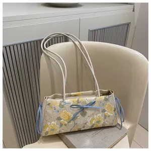 Chic Chinese style embroidered shoulder bag with cute blue bows and vintage floral pattern.