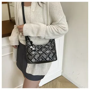 Chinese style single shoulder crossbody bag with unique geometric pattern and chic beaded strap.