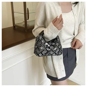 Traditional Chinese style women's shoulder bag with unique geometric pattern and chic design.
